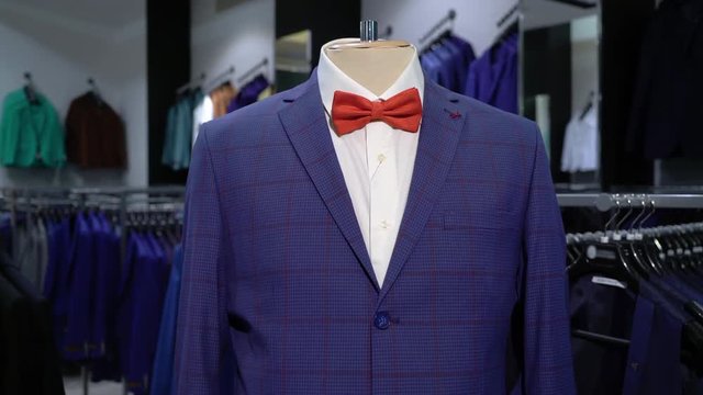 Luxury men fashion suit displaying on mannequin in store