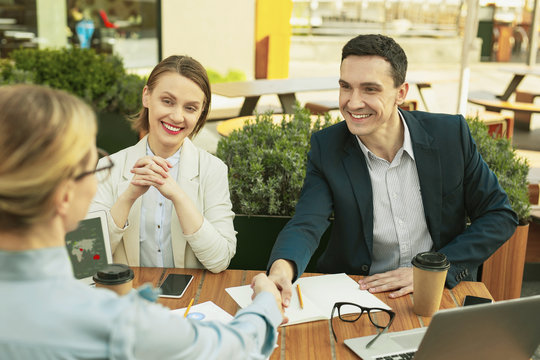 Joyful partners feeling good after important meeting