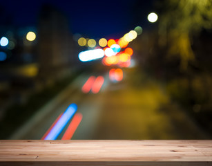 empty table from a light wood with bokeh background
