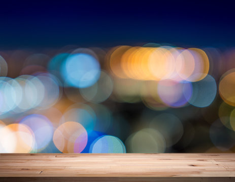empty table from a light wood with bokeh background
