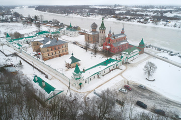 View of the Staraya Ladoga Nikolsky Monastery on a foggy February day (aerial photography). Staraya Ladoga, Russia