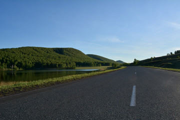 A road to home under blue sky, Uzhur district, Krasnoyarsk region, Russia