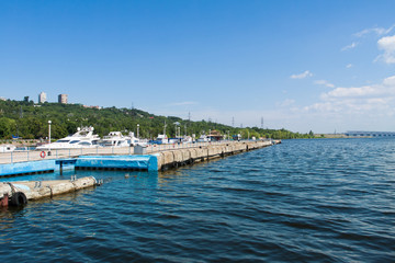 Fototapeta na wymiar Berth with boats on the Volga river.