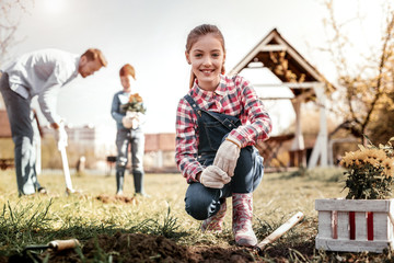 Smiling daughter preparing for helping her father