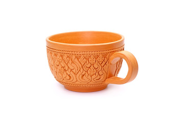Coffee cup : Thai traditional style earthenware coffee cup Isolated on white background. Beautiful coffee cup from Thailand, famous carved earthenware. Handmade pottery.