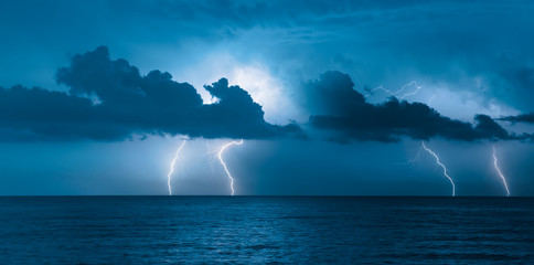 Beautiful sea landscape and storm beginning with lightning