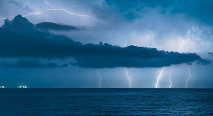 Beautiful sea landscape and storm beginning with lightning