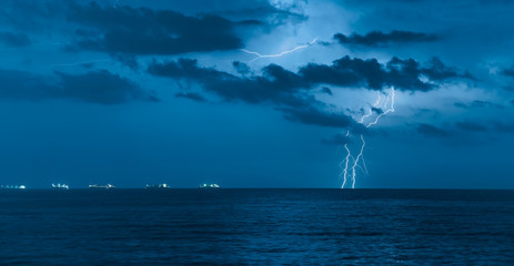 Beautiful sea landscape and storm beginning with lightning