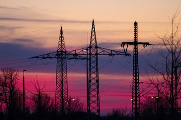 electricity cable on power pole in sunset at munich, bavaria