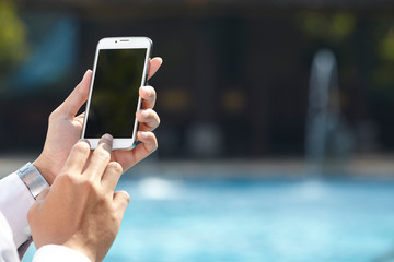 unrecognizable businessman using phone