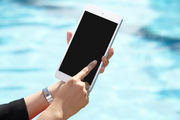 unrecognizable businesswoman using tablet