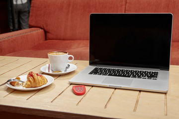 laptop and snack on cafe's table