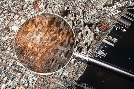 San Francisco city aerial view and magnifying glass.The concept of finding the right address in the city. Elements of this image furnished by NASA.