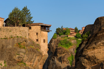 Fototapeta premium Magnificent spring landscape.Beautiful view on the Holy Monasteries of Great Meteoron and Varlaam placed on edge of high rocks. Pindos Mountains, Thessaly, Greece, Europe