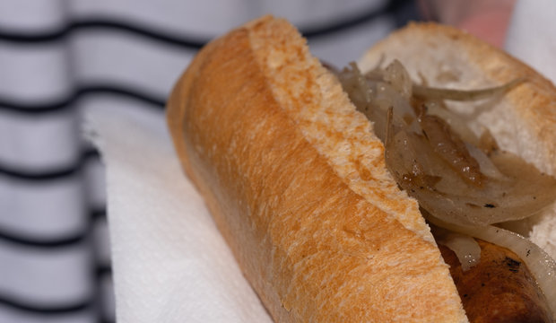 Closeup Image Of A Cooked Sausage In A Bread Roll At An Australian Election Barbecue Fund Raiser