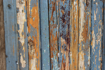 Texture of old weathered boards. Natural background. A fence of boards.