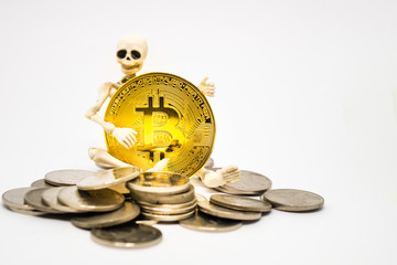 Skeleton figure holding a golden bitcoin