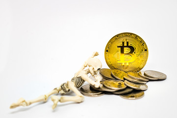 Skeleton figure with golden bitcoin