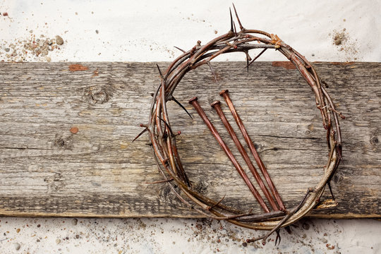 Jesus Crown Thorns and nails on Old and Grunge Wood Background. Vintage Retro Style.