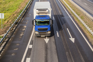 powerful truck moves on highway