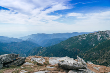 Panorama of Carpathians mountains and famous Transalpina road. Romania’s scenic drives Transalpina, climbing to the top of a mountain. One of the oldest road over the Carpathian Mountains