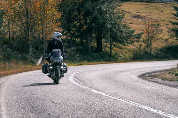 motorcycle adventure on the summit of the mountain road, rider, dual sport. in action.