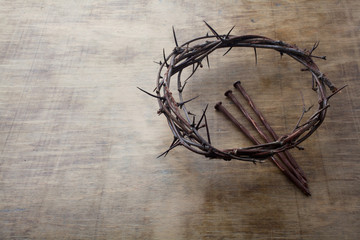 Jesus Crown Thorns and nails on Old and Grunge Wood Background. Vintage Retro Style. Free space for text