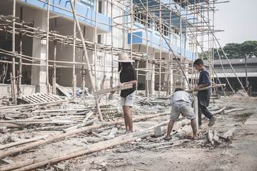 Concept of poverty and child labor, Children who are working on construction sites ,  Against child labor, Poor children,  construction work, Violence children and trafficking concept