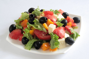 Greek salad on white background