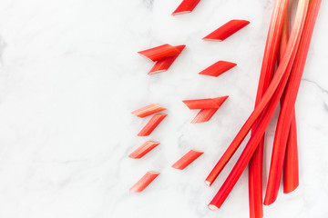 Arrangement of Forced Rhubarb stalks and Pieces on White Background