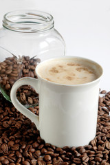 Still-life with coffee with cinnamon on white background