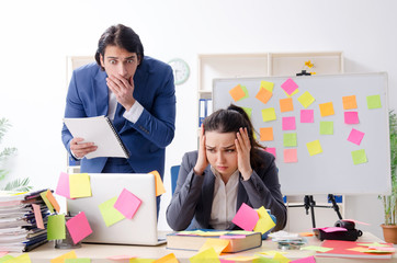 Two colleagues employees working in the office