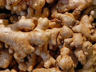 Selective focus of fresh gingers collected, cleaned up, and ready for sale in a supermarket