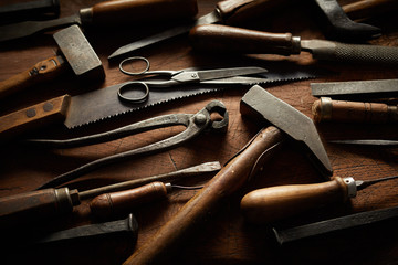 Collection of vintage hand tools with wood handles