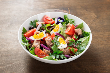 Tuna Fish Salad with Lettuce, Cherry Tomatoes, egg and olives.