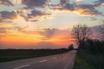 Sunset in countryside landscape.