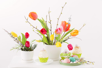 Easter arrangement with tulips and cupcakes
