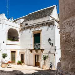 Walking in Locorotondo. Narrow streets and white houses. Dreamlike Puglia, Italy