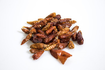 Red dried hot peppers isolated in a white background
