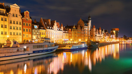 Fototapeta na wymiar Night view of Gdansk harbor and Motlawa river, located in the Old Town of Gdansk city, Poland