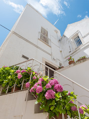 Walking in Locorotondo. Narrow streets and white houses. Dreamlike Puglia, Italy