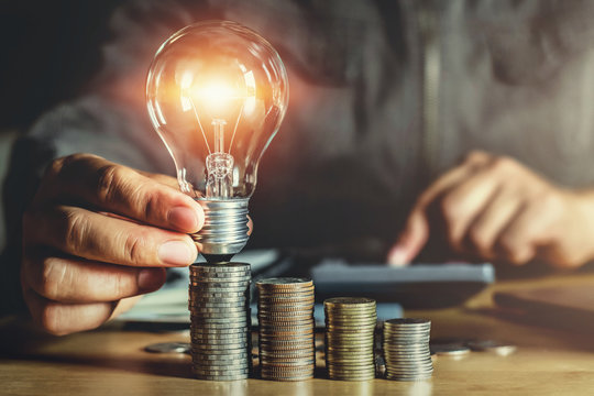 businessman hand holding light bulb. idea concept with innovation and inspiration