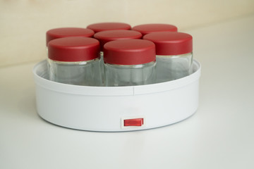 Yogurt maker closeup on the kitchen table
