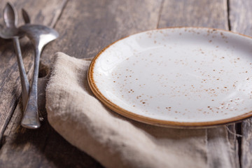 white plate on wooden background