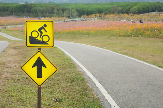 Warning bicycle road signs downhill with bicycle lane on the hill with copy space , Road sign for bike, Downhill bike sign