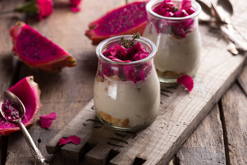 Yogurt with Ripe Dragon fruit, Pitaya or Pitahaya on wooden background, fruit healthy concept