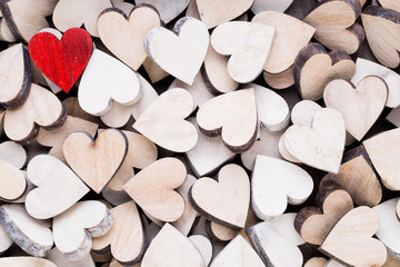 Obraz premium Valentines day background with white end red hearts on wooden background.