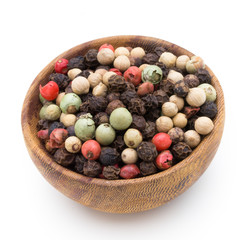 Pepper mix seed on spoon on white background.