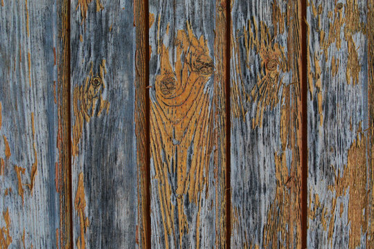 old weathered boards vertical shabby cracked paint yellow close-up texture old wood background grunge