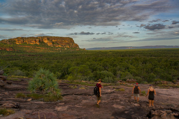 tourists walking down from the Nadab Lookout in ubirr, kakadu national park - australia, northern territory © Martin